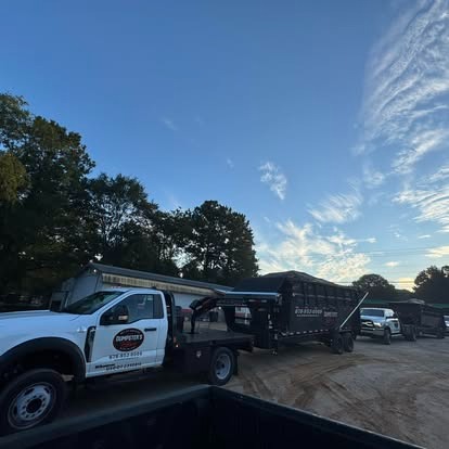 A Dumpsters on Demand truck and roll off trailer at the yard